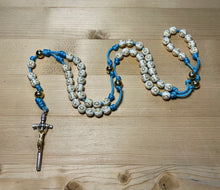 Load image into Gallery viewer, Aqua Paracord - Cream Acrylic Cross & Steel Gold Bead Rosary