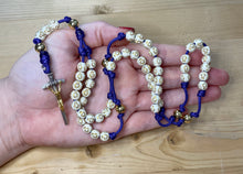 Load image into Gallery viewer, Purple Paracord - Cream Acrylic Cross &amp; Steel Gold Bead Rosary